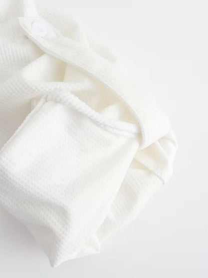 Effortless White Waffle Knit Blouse for Women with Band Collar Long Sleeve Roll Tab Cuff Casual Style