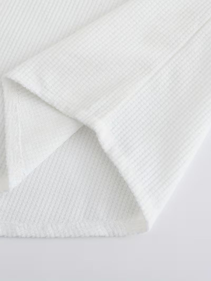 Effortless White Waffle Knit Blouse for Women with Band Collar Long Sleeve Roll Tab Cuff Casual Style