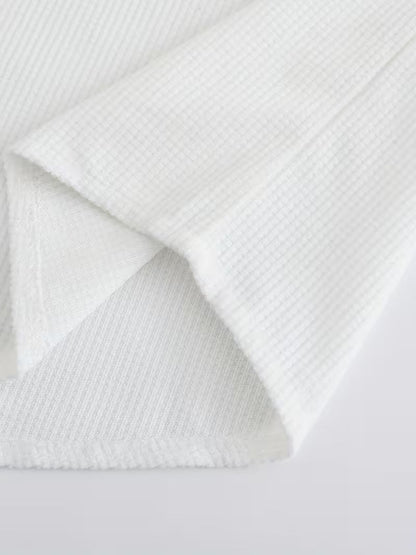 Effortless White Waffle Knit Blouse for Women with Band Collar Long Sleeve Roll Tab Cuff Casual Style